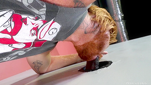Tatted Redhead Devours Huge Black Cock at Gloryhole – Steamy Interracial Encounter