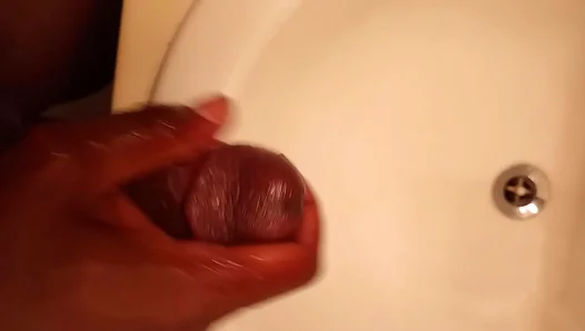 Big ebony stud strokes his thick cock hard until cum blasts out—intense solo jerk off